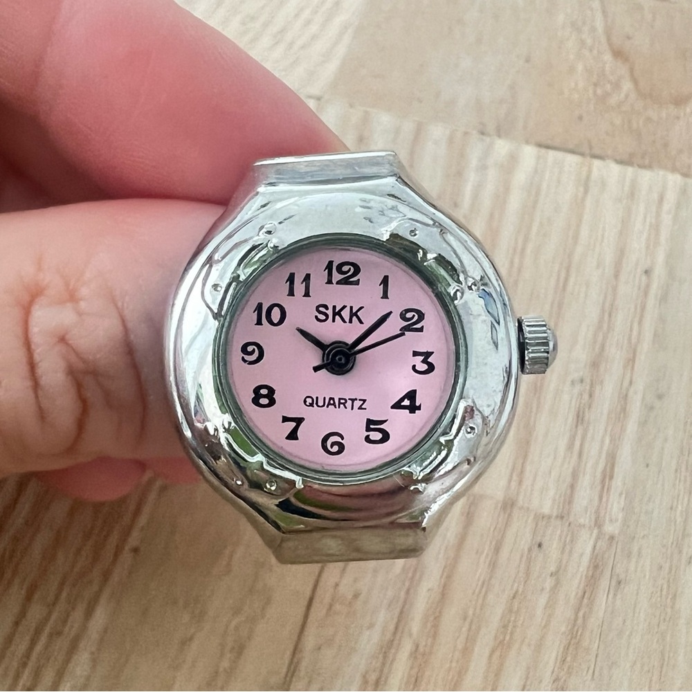 Skk ladies pink and silver tone dolphin ring watch NEW BATTERY